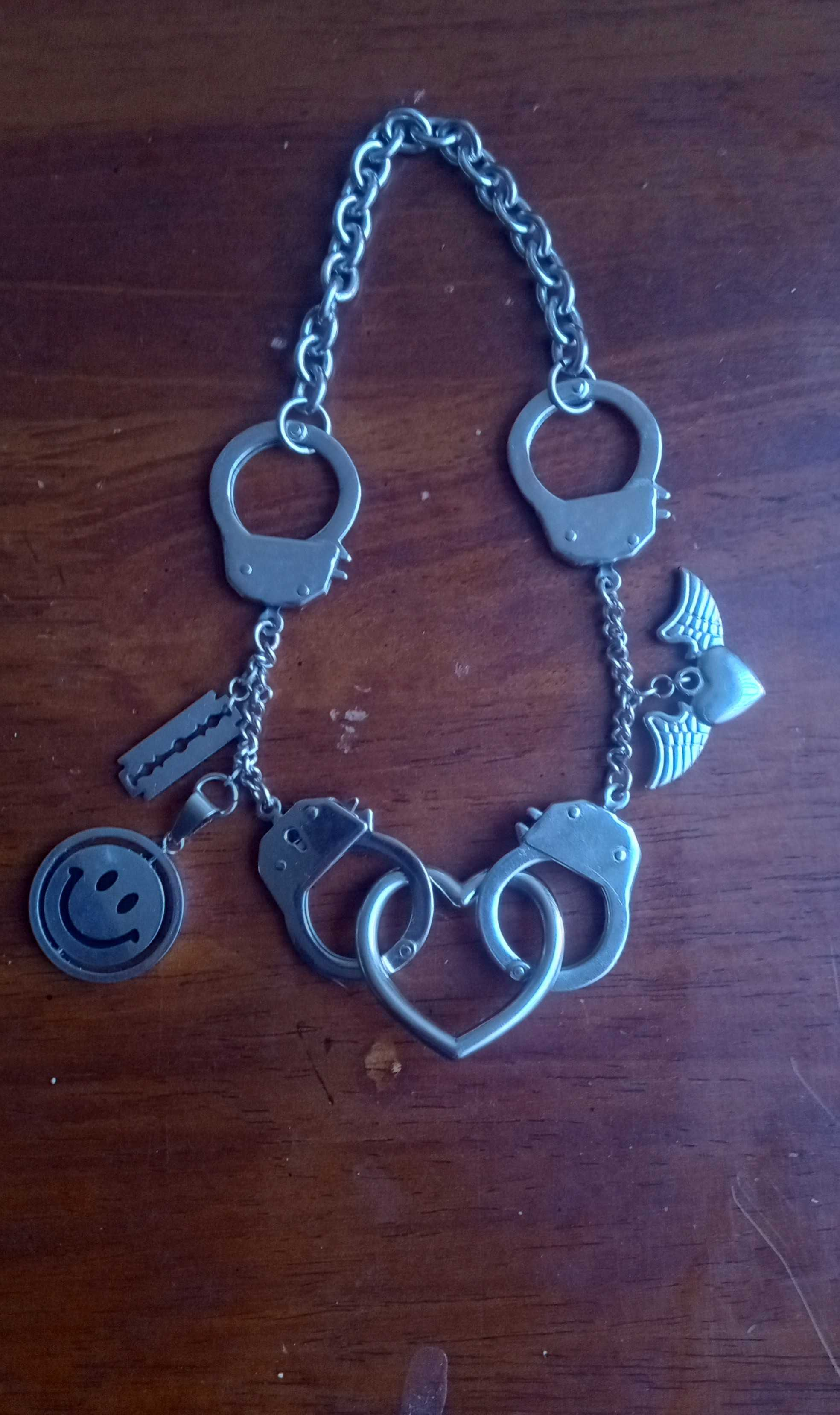 heart necklace with hand cuffs